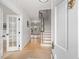 Bright entryway with hardwood floors and elegant staircase at 191 Pine Lake Dr, Siler City, NC 27344