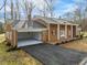 Brick ranch house with attached garage and covered porch at 191 Pine Lake Dr, Siler City, NC 27344