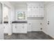 Laundry room with white cabinets and dark countertops at 191 Pine Lake Dr, Siler City, NC 27344