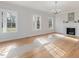 Light-filled living room showcasing hardwood floors and fireplace at 191 Pine Lake Dr, Siler City, NC 27344