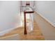 View of a graceful staircase from the upper level at 191 Pine Lake Dr, Siler City, NC 27344