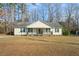 House exterior featuring a front porch and well-maintained lawn at 204 Barbour Rd, Smithfield, NC 27577