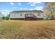 Back of house with deck and yard at 204 Barbour Rd, Smithfield, NC 27577