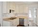 Well-equipped kitchen with ample cabinet space and double sink at 204 Barbour Rd, Smithfield, NC 27577