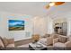Virtually staged living room featuring comfortable seating and a large TV at 204 Barbour Rd, Smithfield, NC 27577