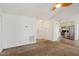 Bright living room with vaulted ceiling, carpet, and kitchen view at 204 Barbour Rd, Smithfield, NC 27577