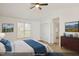 Virtually staged main bedroom with a ceiling fan and window at 204 Barbour Rd, Smithfield, NC 27577