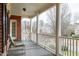 Relaxing covered porch with brick columns and neighborhood view at 422 Wayfield Ln, Cary, NC 27518