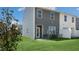 Private backyard with patio and green lawn at 454 Belgian Red Way, Wake Forest, NC 27587