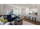 Open living room featuring a sectional sofa and kitchen island view at 454 Belgian Red Way, Wake Forest, NC 27587