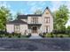 Modern two-story house with a stylish facade and landscaping at 684 Golfers Vw, Pittsboro, NC 27312