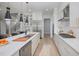 Open concept kitchen boasts stainless steel appliances and large island at 684 Golfers Vw, Pittsboro, NC 27312