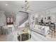 Open concept living area with high ceilings, hardwood floors, and a staircase at 684 Golfers Vw, Pittsboro, NC 27312