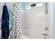 Bathroom with white tub, shower, and patterned shower curtain at 722 Blue Lake Dr, Mebane, NC 27302