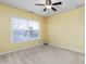 Well-lit bedroom with neutral walls and carpet flooring at 722 Blue Lake Dr, Mebane, NC 27302
