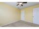 Bright bedroom with ceiling fan and carpet at 722 Blue Lake Dr, Mebane, NC 27302