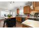 Modern kitchen with wood cabinets, stainless steel appliances and an island at 722 Blue Lake Dr, Mebane, NC 27302