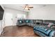 Spacious living room with sectional sofa and hardwood floors at 722 Blue Lake Dr, Mebane, NC 27302