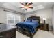 Large main bedroom with a king-size bed and dark brown dresser at 722 Blue Lake Dr, Mebane, NC 27302