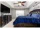 Main bedroom with king-size bed, dark brown dresser, and large TV at 722 Blue Lake Dr, Mebane, NC 27302