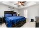 Main bedroom with king bed, dark wood furniture, and ceiling fan at 722 Blue Lake Dr, Mebane, NC 27302