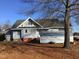 Gray house with large yard, covered parking, and shed at 8173 Nc Hwy 210 N, Angier, NC 27501