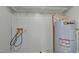 Laundry room features shelving, water heater, and hookups at 826 Carter Ave, Durham, NC 27703
