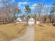 Aerial view of house, driveway, and detached shed at 101 Creekside Dr, Selma, NC 27576