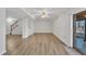 Spacious basement room with laminate floors, a ceiling fan, and access to the backyard at 101 Creekside Dr, Selma, NC 27576