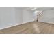 Finished basement with wood-look floors and stairway at 101 Creekside Dr, Selma, NC 27576