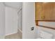 Neat bathroom with shower and wooden shelving at 101 Creekside Dr, Selma, NC 27576