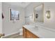 Bright bathroom boasts a vanity with sink, toilet and shower at 101 Creekside Dr, Selma, NC 27576