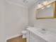 Simple bathroom with white vanity and gold mirror at 101 Creekside Dr, Selma, NC 27576