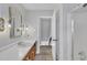 Bathroom features a vanity, sink, and access to a hallway at 101 Creekside Dr, Selma, NC 27576