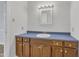 Simple bathroom, featuring wood cabinets and a vanity sink at 101 Creekside Dr, Selma, NC 27576