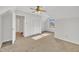 Large bedroom with carpet, ceiling fan, and double doors at 101 Creekside Dr, Selma, NC 27576