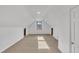 Bright attic bedroom with carpet and window at 101 Creekside Dr, Selma, NC 27576