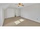 Spacious bedroom with carpet flooring, ceiling fan, and double closets at 101 Creekside Dr, Selma, NC 27576