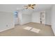 Bright bedroom featuring carpet floors, ceiling fan, and window at 101 Creekside Dr, Selma, NC 27576