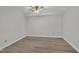 Simple bedroom with laminate floors and a ceiling fan at 101 Creekside Dr, Selma, NC 27576