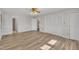 Spacious bedroom with hardwood floors and ceiling fan at 101 Creekside Dr, Selma, NC 27576