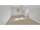 Cozy bedroom with carpet flooring, a ceiling fan and window at 101 Creekside Dr, Selma, NC 27576