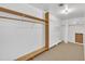 Large walk-in closet with wood shelving and a bench at 101 Creekside Dr, Selma, NC 27576