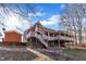 Two-story house with large deck and detached shed at 101 Creekside Dr, Selma, NC 27576