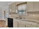 Kitchen features granite countertops, updated cabinetry, and a view to the deck at 101 Creekside Dr, Selma, NC 27576