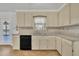 Bright kitchen features granite countertops, updated cabinetry, and a view to the deck at 101 Creekside Dr, Selma, NC 27576