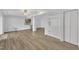 Bright living room featuring laminate floors and a ceiling fan at 101 Creekside Dr, Selma, NC 27576