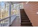 Exterior stairs leading down from deck to backyard at 101 Creekside Dr, Selma, NC 27576
