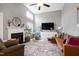 Living room with fireplace and access to back porch at 103 Lakeleaf Ct, Cary, NC 27518