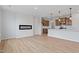Spacious dining area with hardwood floors and an electric fireplace at 1042 Westerland Way # 213, Durham, NC 27703